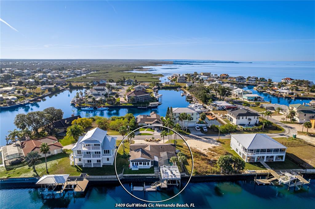 3409 Gulf Winds Circle Hernando Beach, FL 34607 - Photo 34 of 84 an aerial view of residential houses with outdoor space