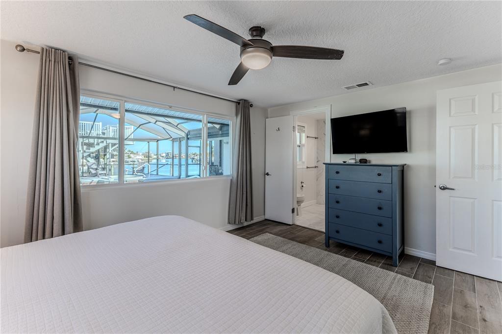 3409 Gulf Winds Circle Hernando Beach, FL 34607 - Photo 36 of 84 a bedroom with a bed and a flat screen tv