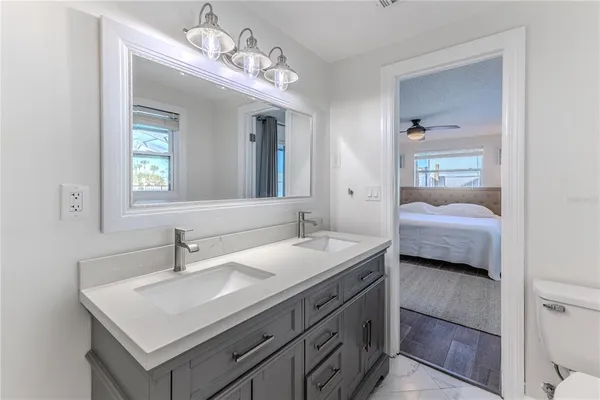 a view of a house with a deck and a yard