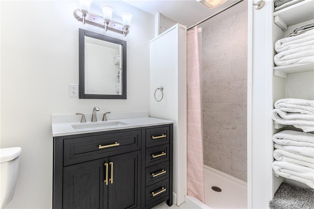 3409 Gulf Winds Circle Hernando Beach, FL 34607 - Photo 49 of 84 a bathroom with a sink a toilet and shower