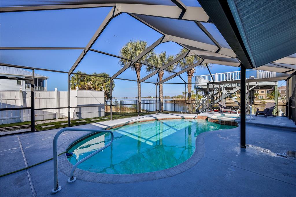3409 Gulf Winds Circle Hernando Beach, FL 34607 - Photo 54 of 84 a view of a swimming pool with a patio