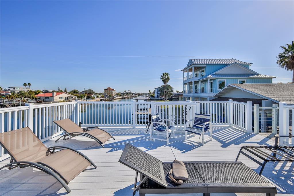 3409 Gulf Winds Circle Hernando Beach, FL 34607 - Photo 68 of 84 a view of a chairs and table on the deck