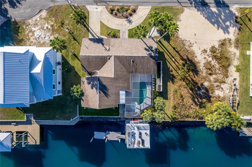 3409 Gulf Winds Circle Hernando Beach, FL 34607 - Photo 78 of 84 an aerial view of a house with garden space and street view
