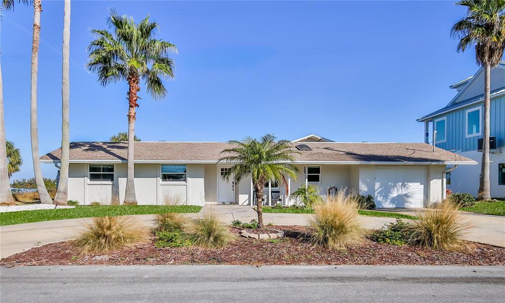 3409 Gulf Winds Circle Hernando Beach, FL 34607 - Photo 8 of 84 a front view of a house with garden