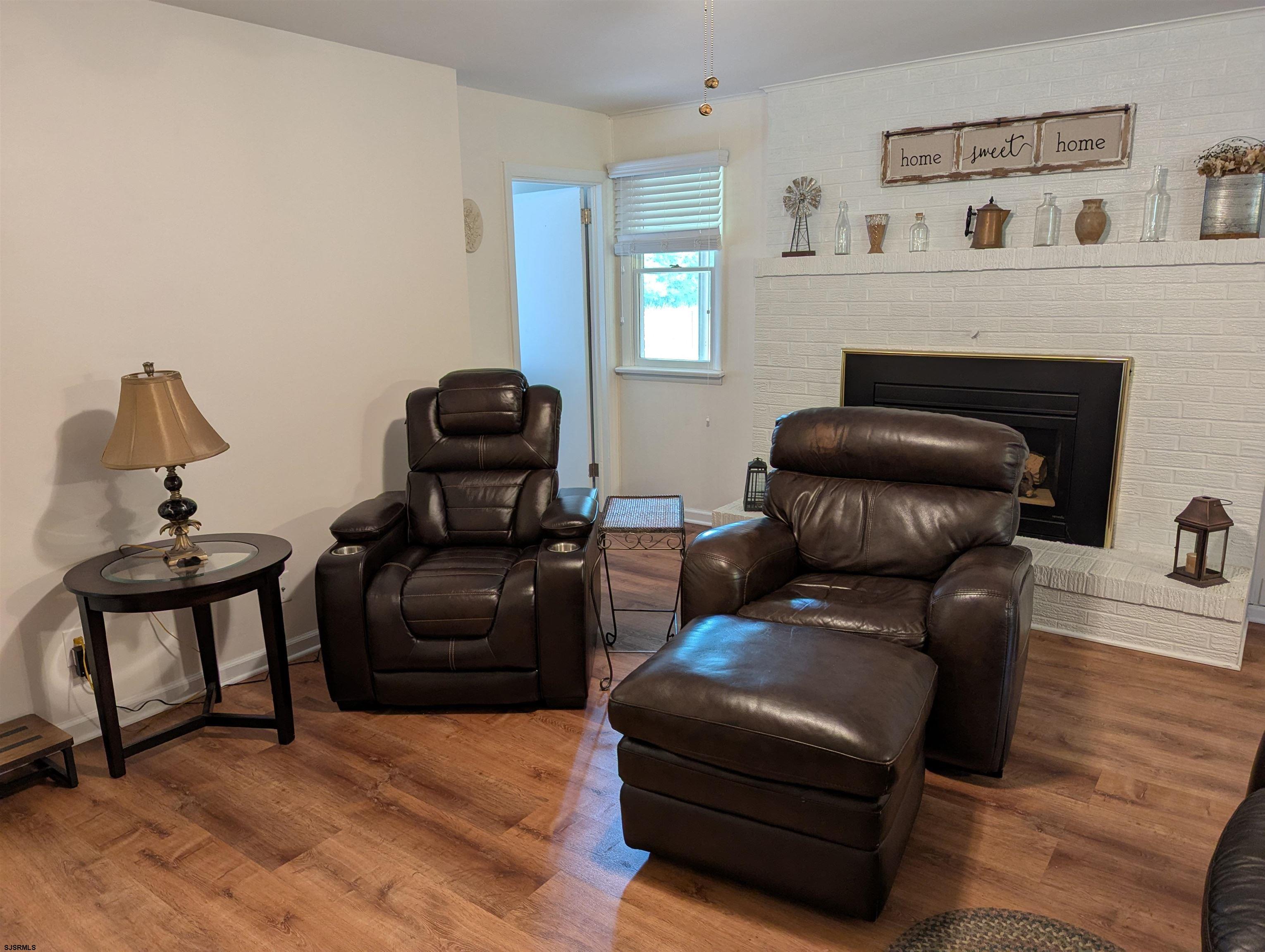 71 Perry Road Woodbine, NJ 08270 - Photo 12 of 32 a living room with furniture and a fireplace