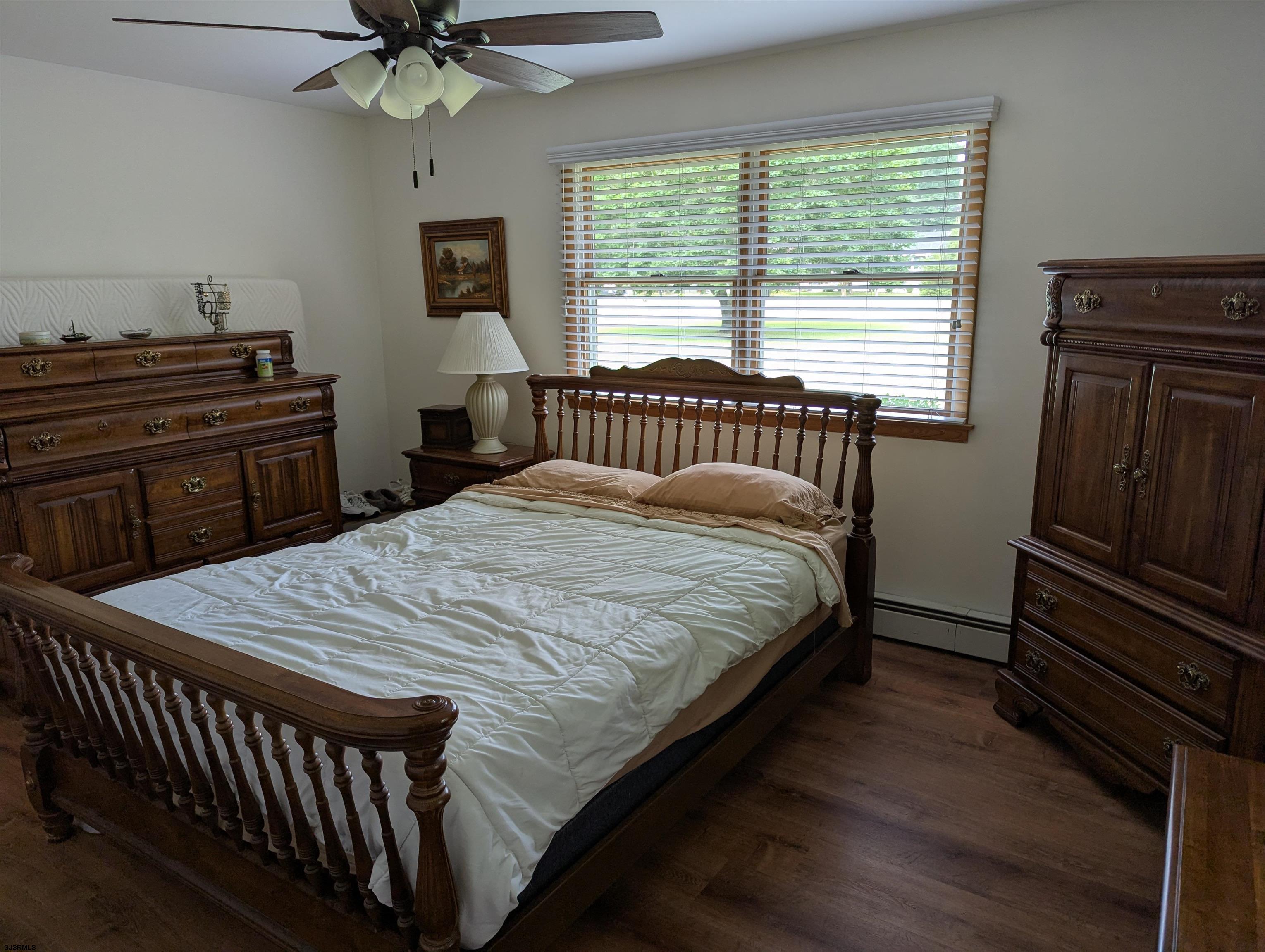 71 Perry Road Woodbine, NJ 08270 - Photo 14 of 32 a bed sitting in a bedroom next to a window