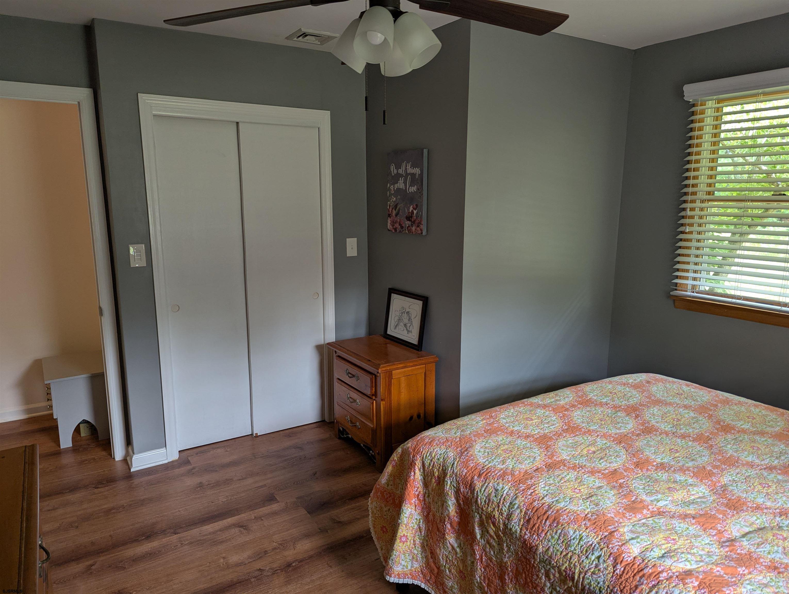 71 Perry Road Woodbine, NJ 08270 - Photo 18 of 32 a bedroom with a bed and a mirror on dresser