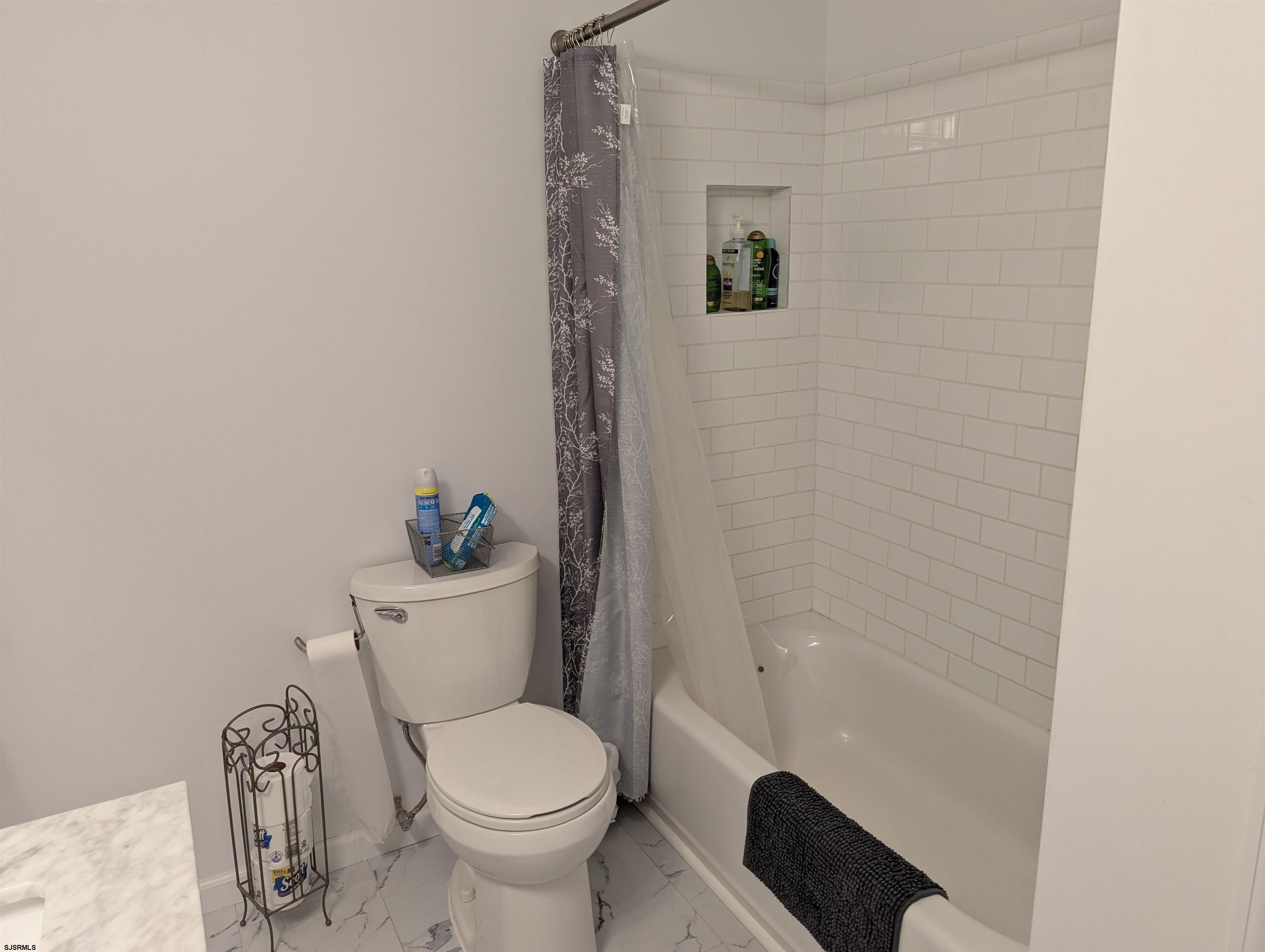 71 Perry Road Woodbine, NJ 08270 - Photo 20 of 32 a white toilet sitting next to a shower