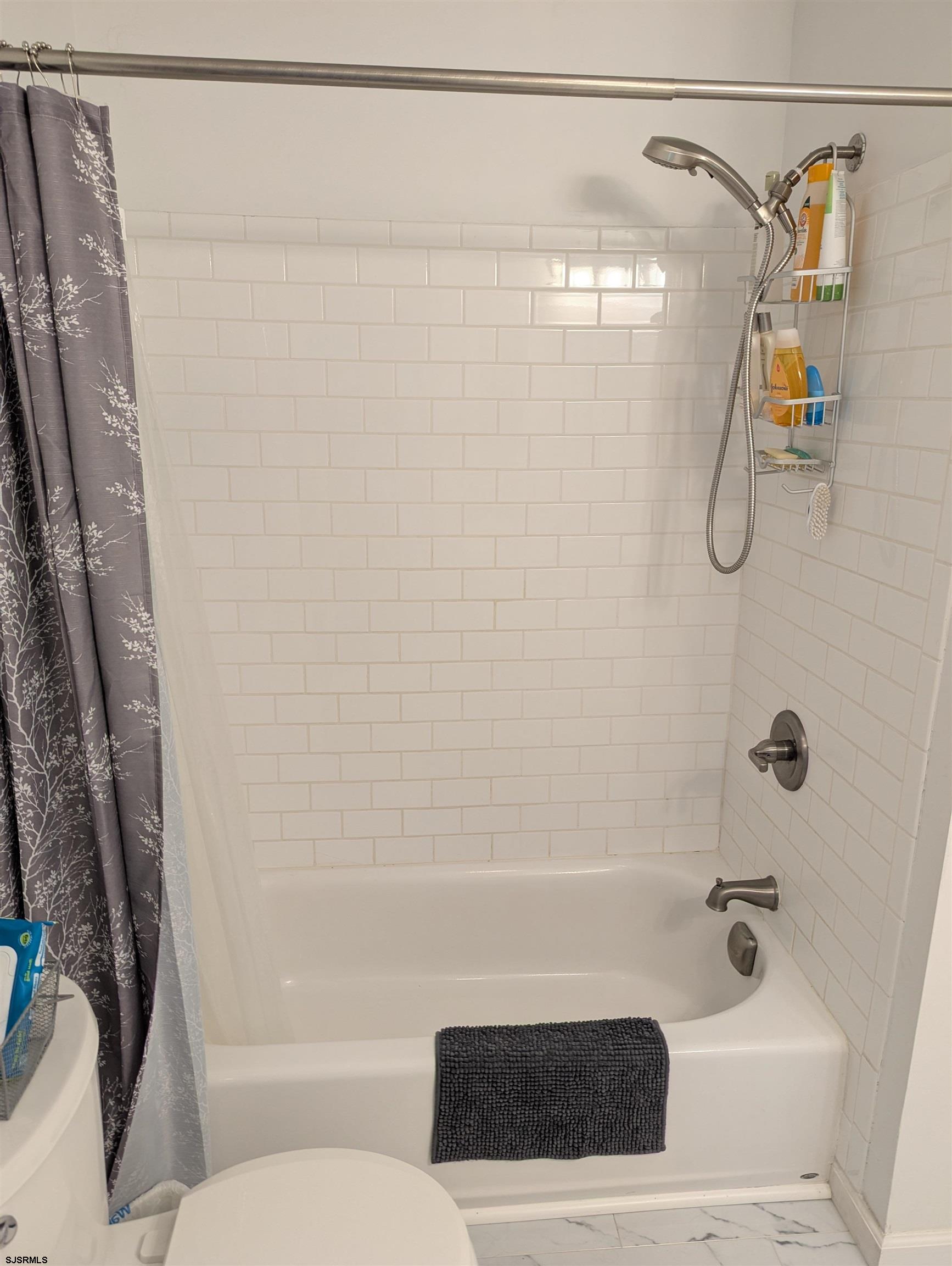71 Perry Road Woodbine, NJ 08270 - Photo 21 of 32 a bathroom with a shower and a bath tub