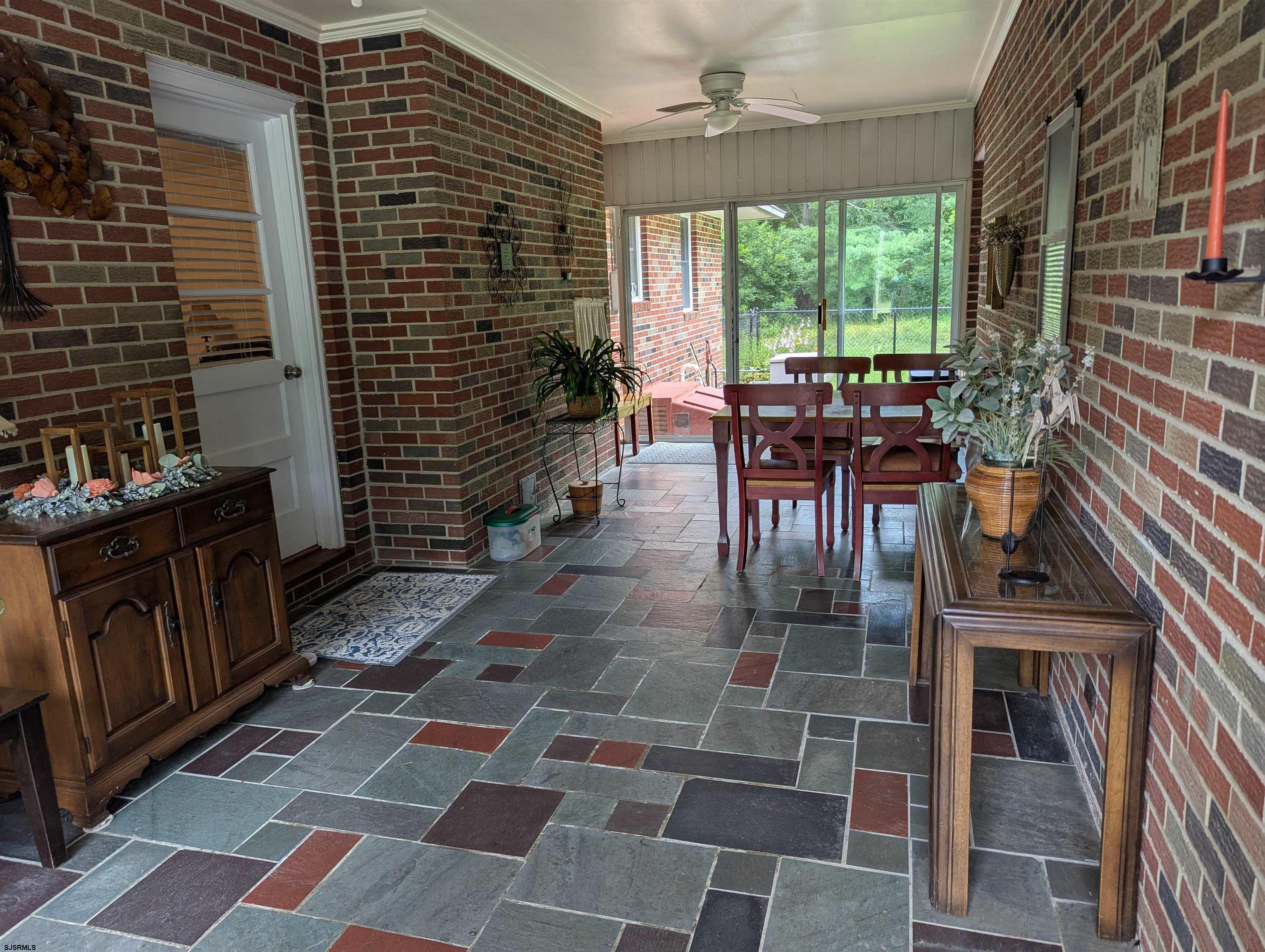 71 Perry Road Woodbine, NJ 08270 - Photo 23 of 32 a dining room with furniture and a rug