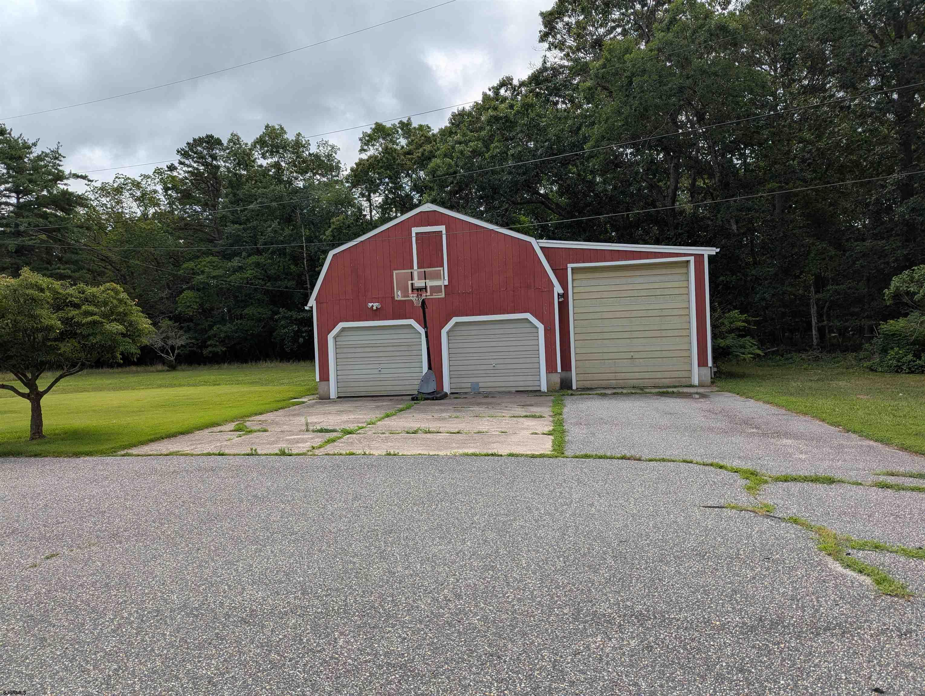71 Perry Road Woodbine, NJ 08270 - Photo 3 of 32 a house with a yard and a large parking space