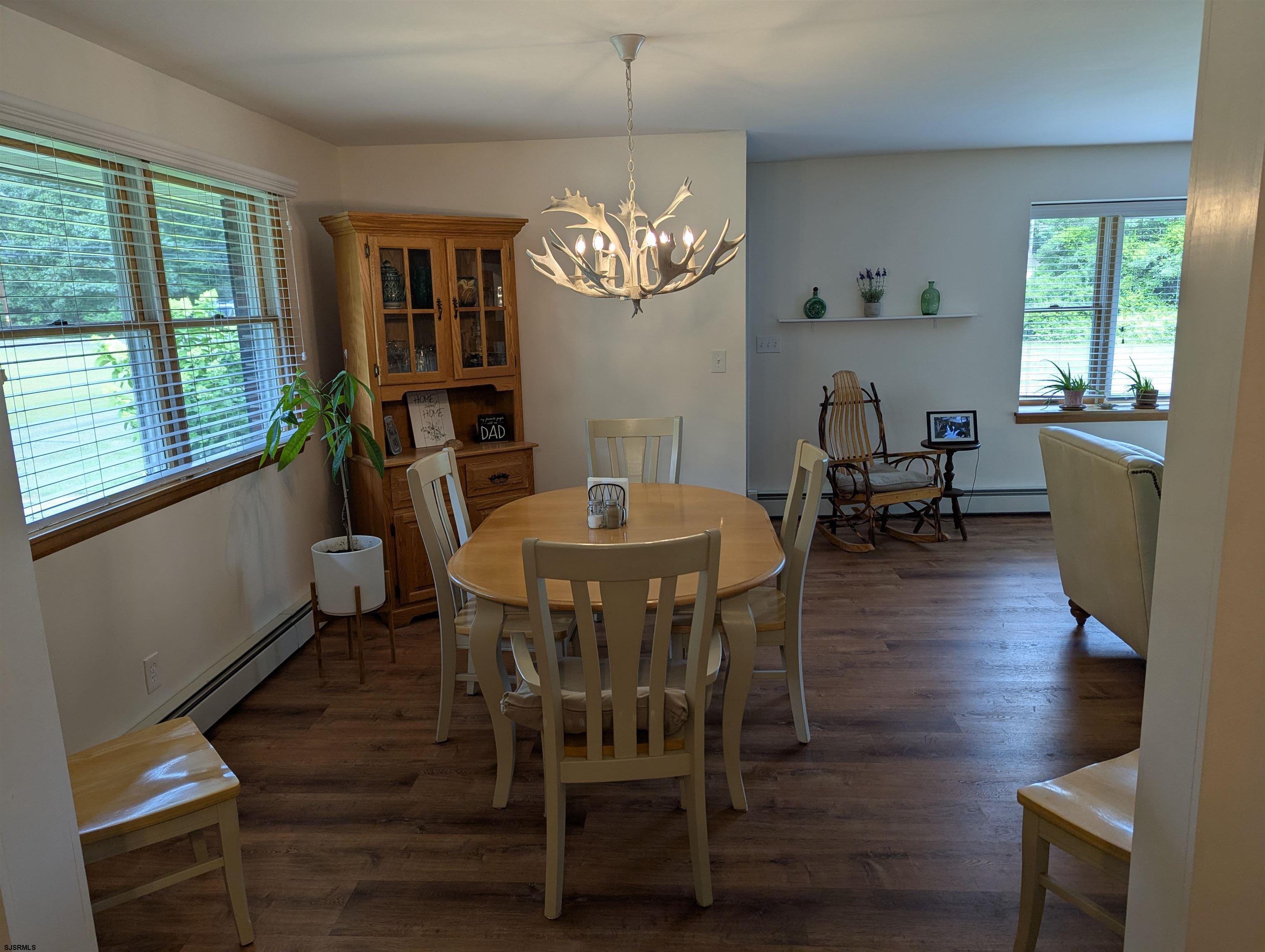 71 Perry Road Woodbine, NJ 08270 - Photo 7 of 32 a view of a dining room with furniture window and wooden floor