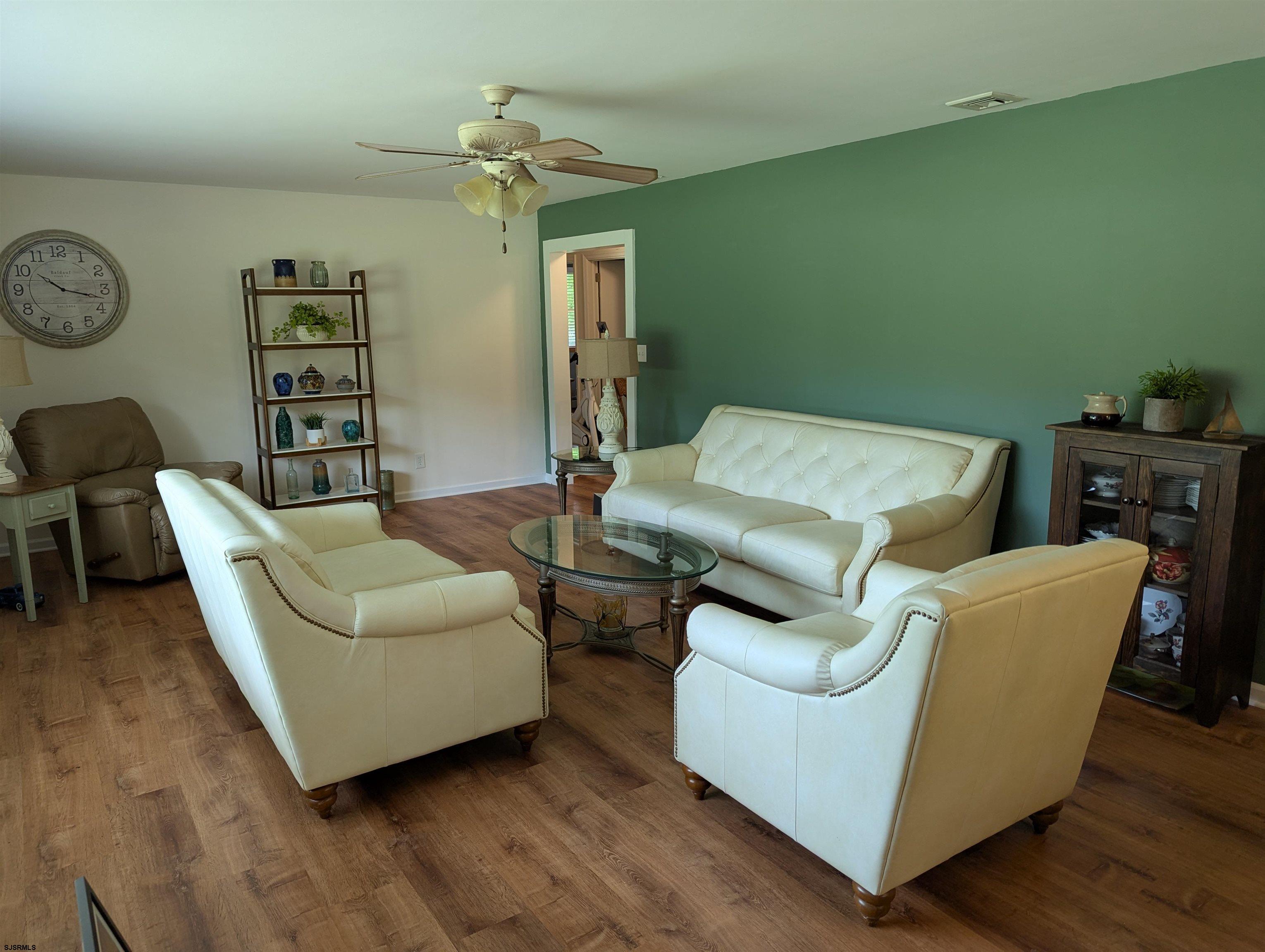 71 Perry Road Woodbine, NJ 08270 - Photo 8 of 32 a living room with furniture and a fireplace