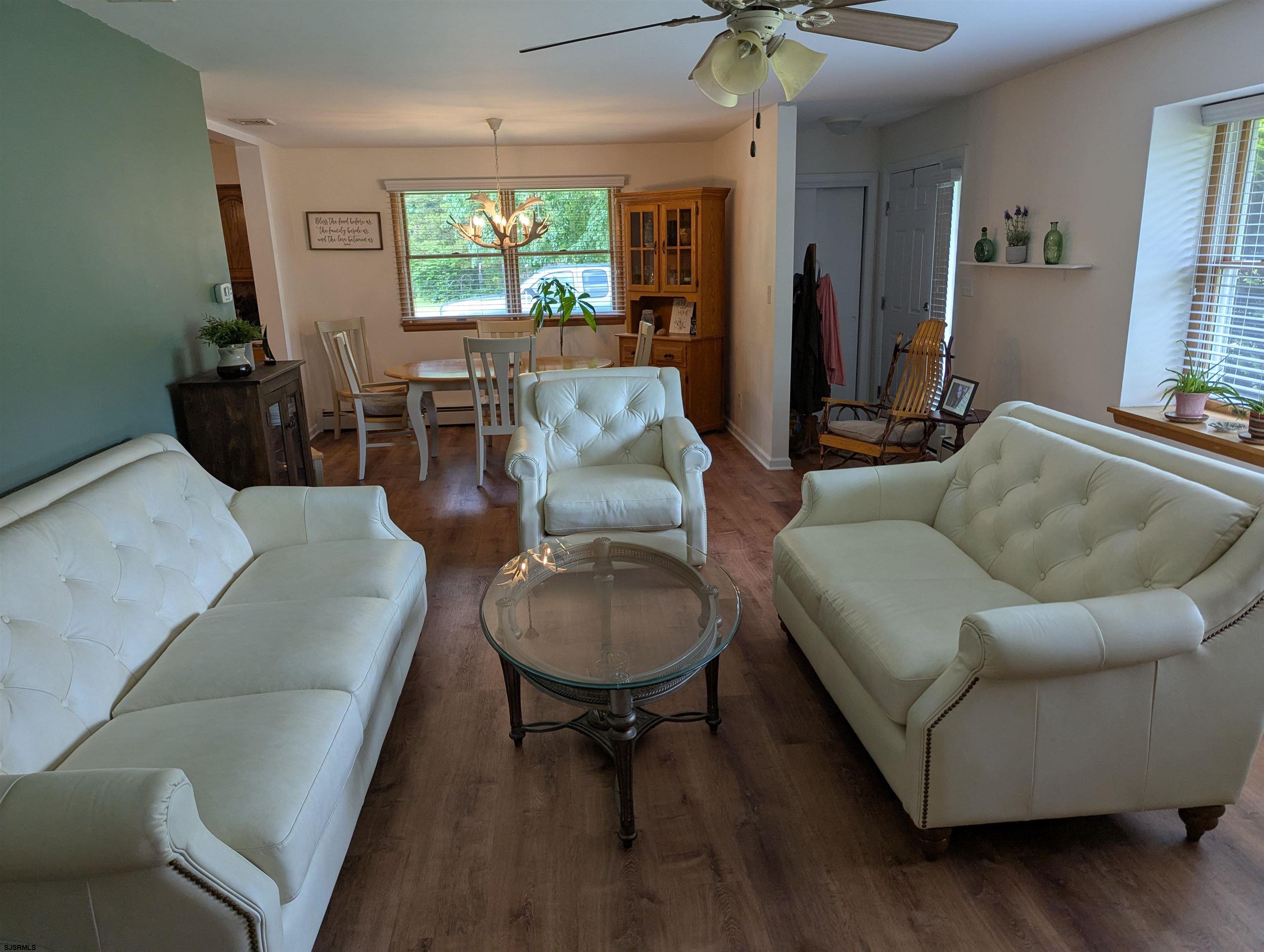 71 Perry Road Woodbine, NJ 08270 - Photo 9 of 32 a living room with furniture and a large window