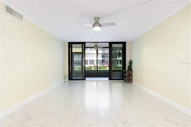 an empty room with a empty space and windows