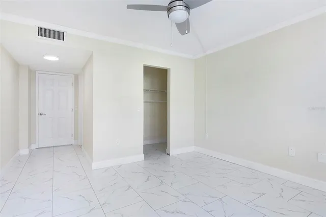 an aerial view of residential houses with outdoor space and lake view