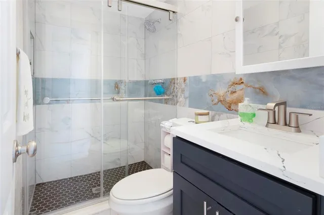 an aerial view of a house with a swimming pool