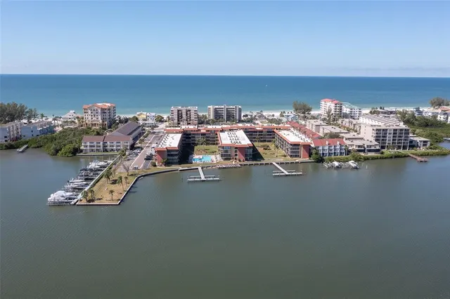 a view of a lake with houses in the background