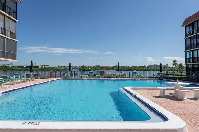 a view of balcony with wooden floor and seating space