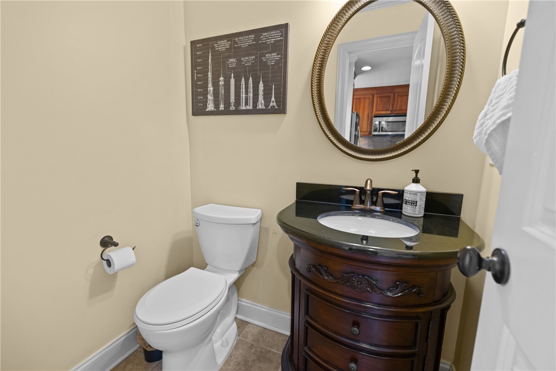 209 Calhoun Street, Unit 201 Clemson, SC 29631 - Photo 16 of 35 This bathroom features an elegant vanity with a sleek countertop and a modern toilet.