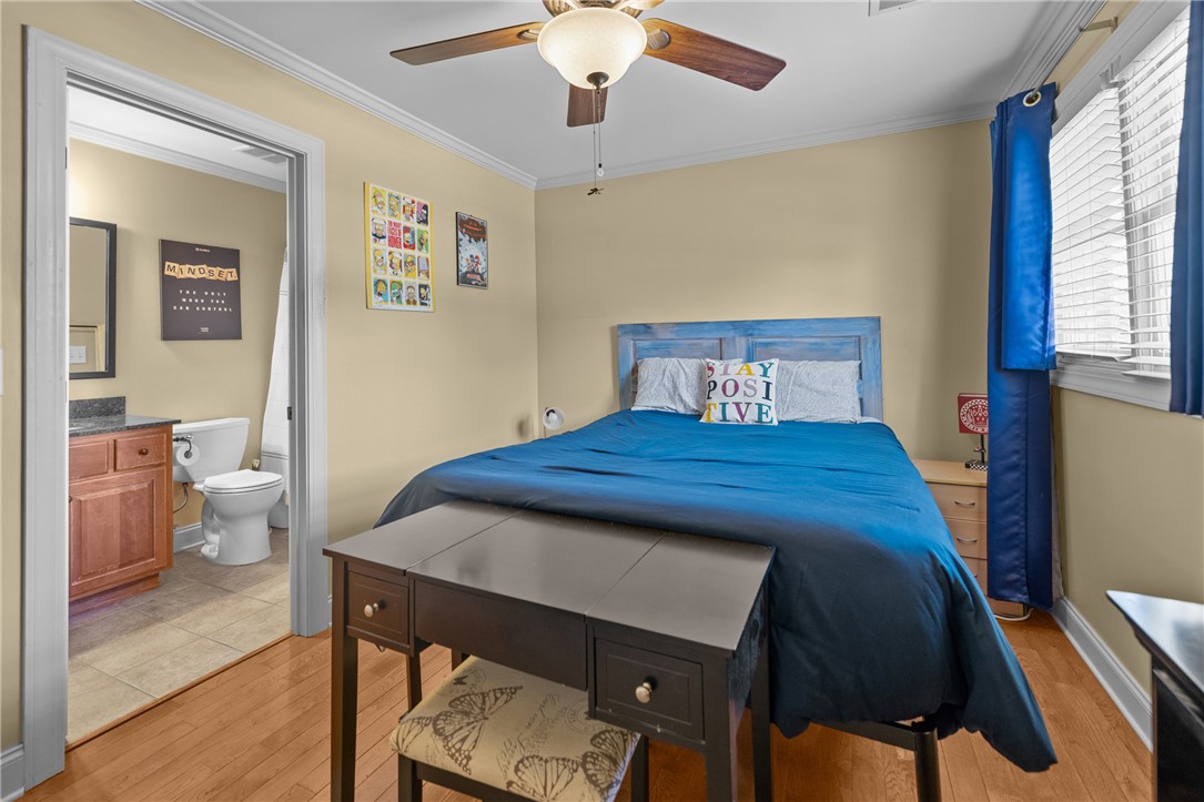 209 Calhoun Street, Unit 201 Clemson, SC 29631 - Photo 19 of 35 This cozy room offers hardwood floors and convenient access to a private bathroom.