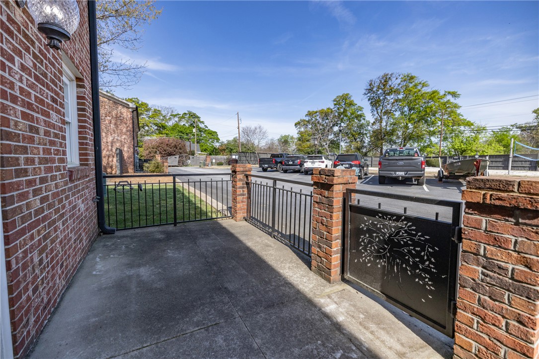 209 Calhoun Street, Unit 201 Clemson, SC 29631 - Photo 24 of 35 This property features brick construction, offering a sturdy and classic aesthetic.