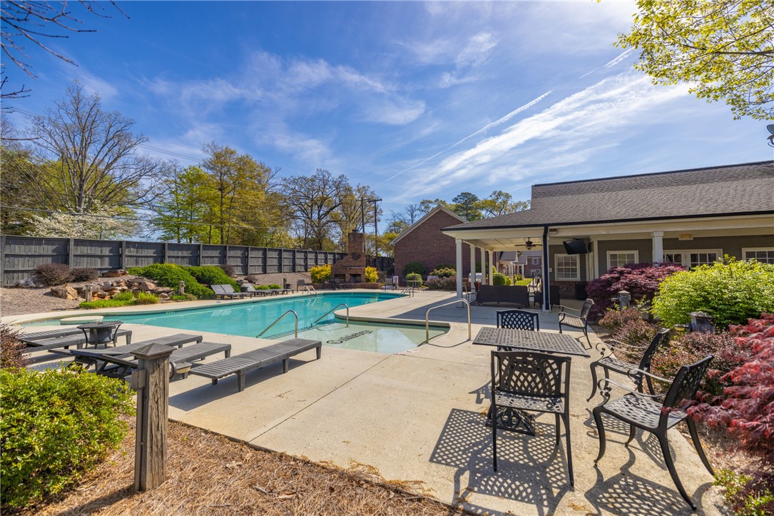 209 Calhoun Street, Unit 201 Clemson, SC 29631 - Photo 31 of 35 This inviting outdoor space features a sparkling pool and a charming patio area, perfect for relaxation.