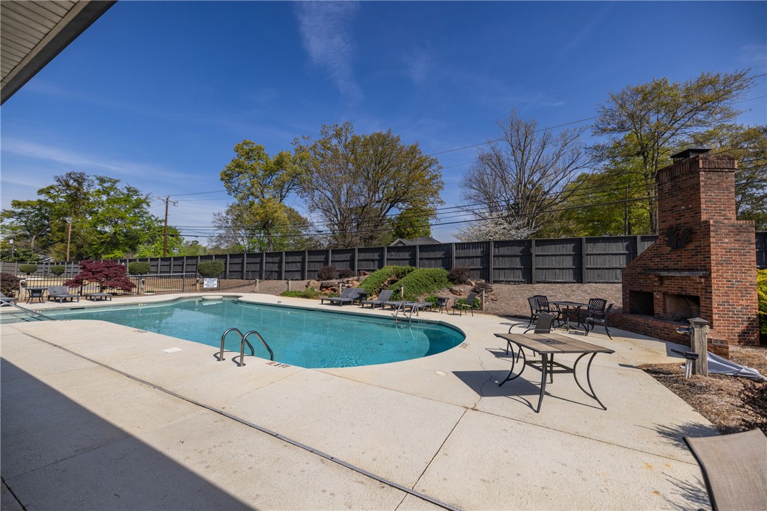 209 Calhoun Street, Unit 201 Clemson, SC 29631 - Photo 33 of 35 This inviting outdoor space features a sparkling pool, perfect for relaxation and recreation.