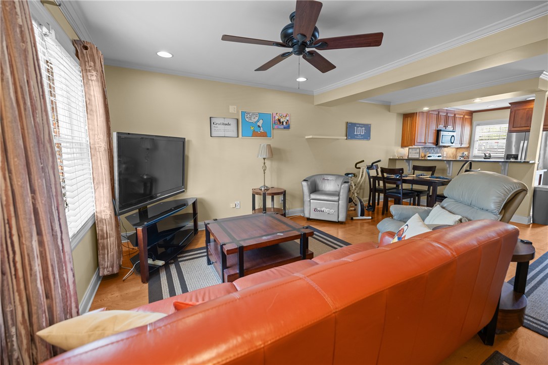 209 Calhoun Street, Unit 201 Clemson, SC 29631 - Photo 4 of 35 This inviting living area seamlessly connects to the kitchen, offering comfort and practicality.