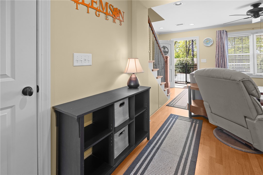 209 Calhoun Street, Unit 201 Clemson, SC 29631 - Photo 8 of 35 This inviting entryway features warm wood flooring, leading to a charming staircase.