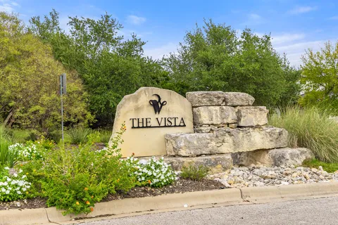 a view of a park with large trees
