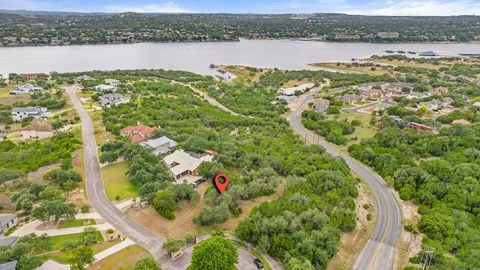 an aerial view of a houses with a lake view