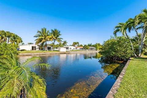 a view of swimming pool with outdoor seating and yard