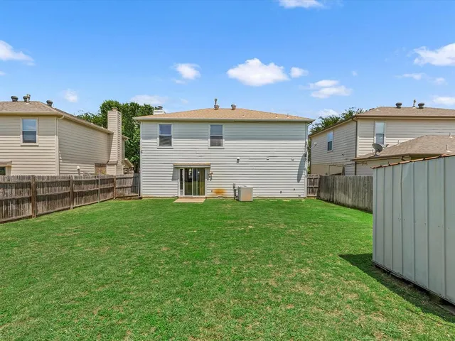 a view of a back yard of the house