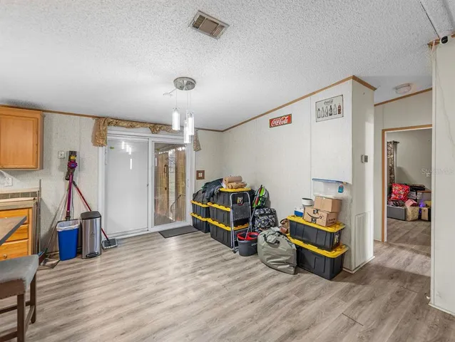 a kitchen with a sink cabinets and window