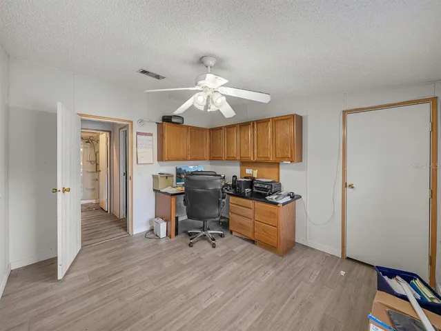a bedroom with a bed and gym equipment