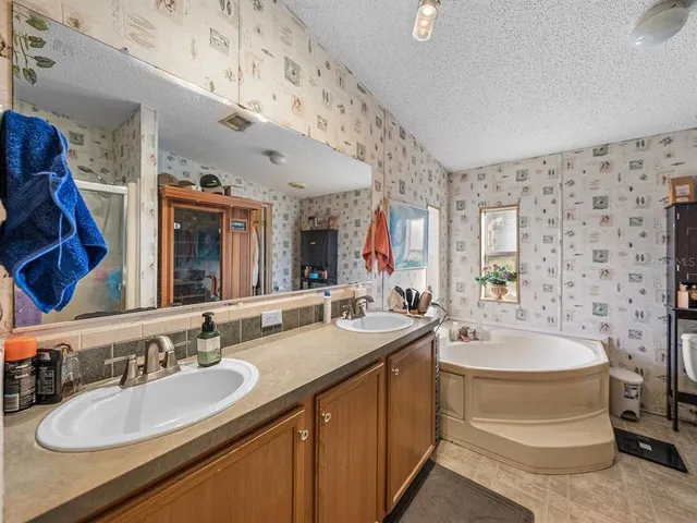 a living room with furniture and floor to ceiling windows