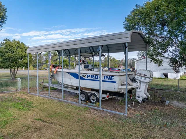 an aerial view of a residential houses with outdoor space