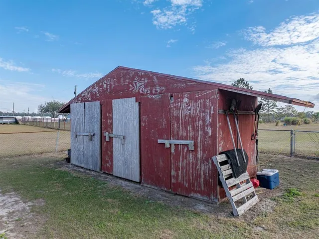 an aerial view of a houses with outdoor space
