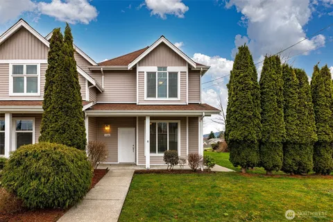 a front view of a house with a yard