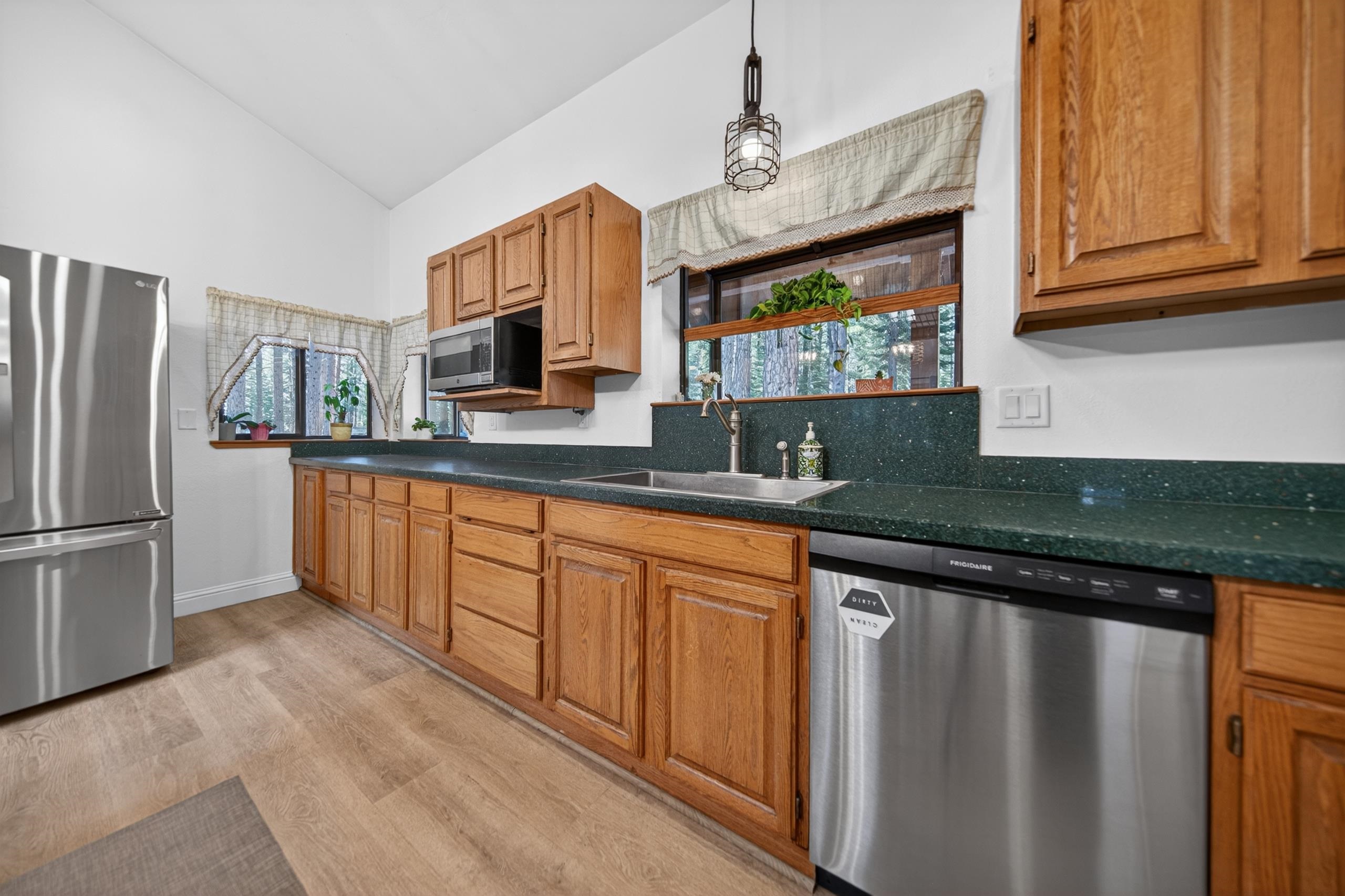 463-000 Moonlight Ranch Rd Westwood Road Susanville, CA 96130 - Photo 5 of 46 a kitchen with granite countertop a sink stainless steel appliances and cabinets