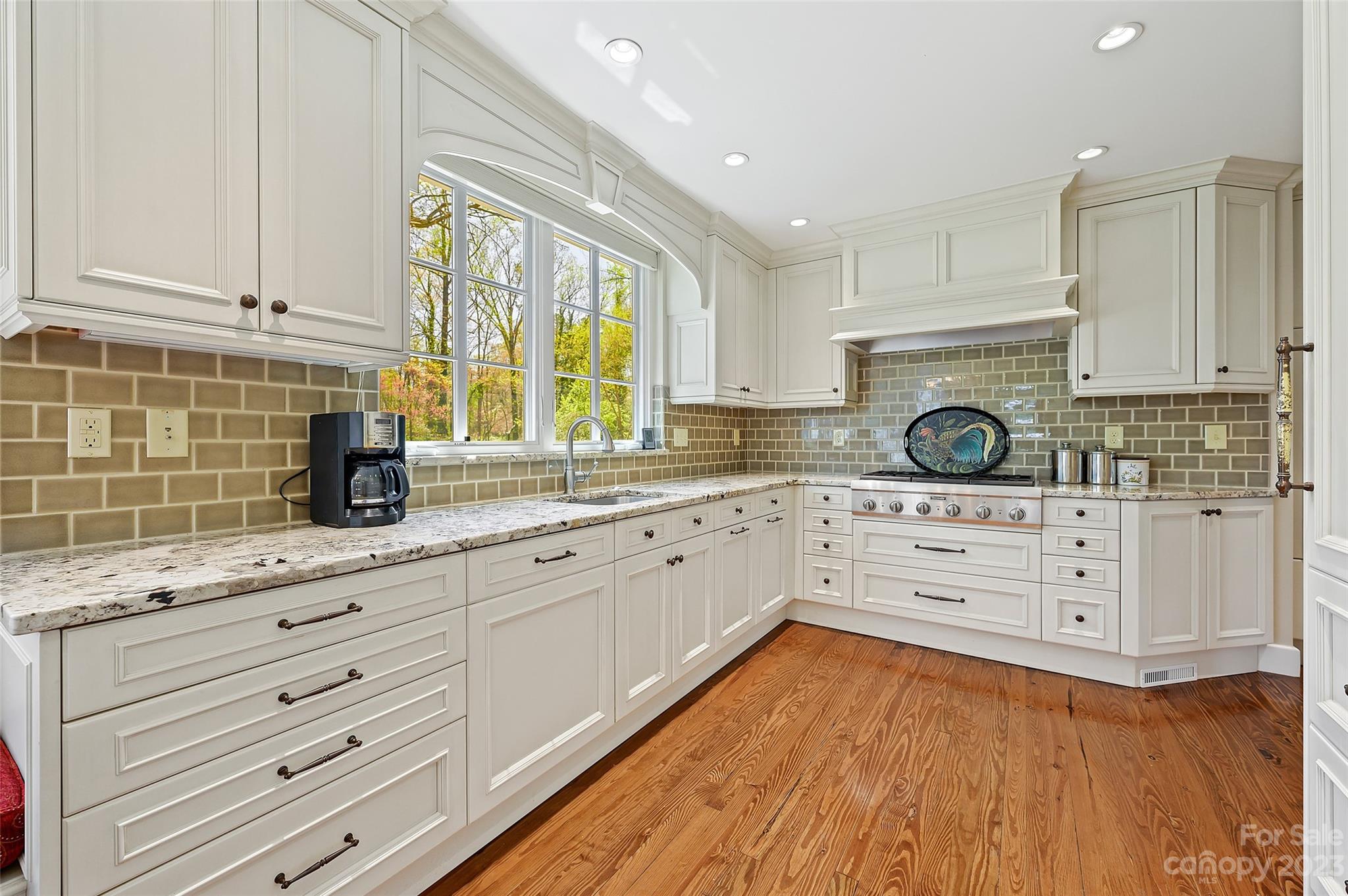 246 Shasta Lane Charlotte, NC 28211 - Photo 12 of 48 a kitchen with granite countertop white cabinets and white appliances