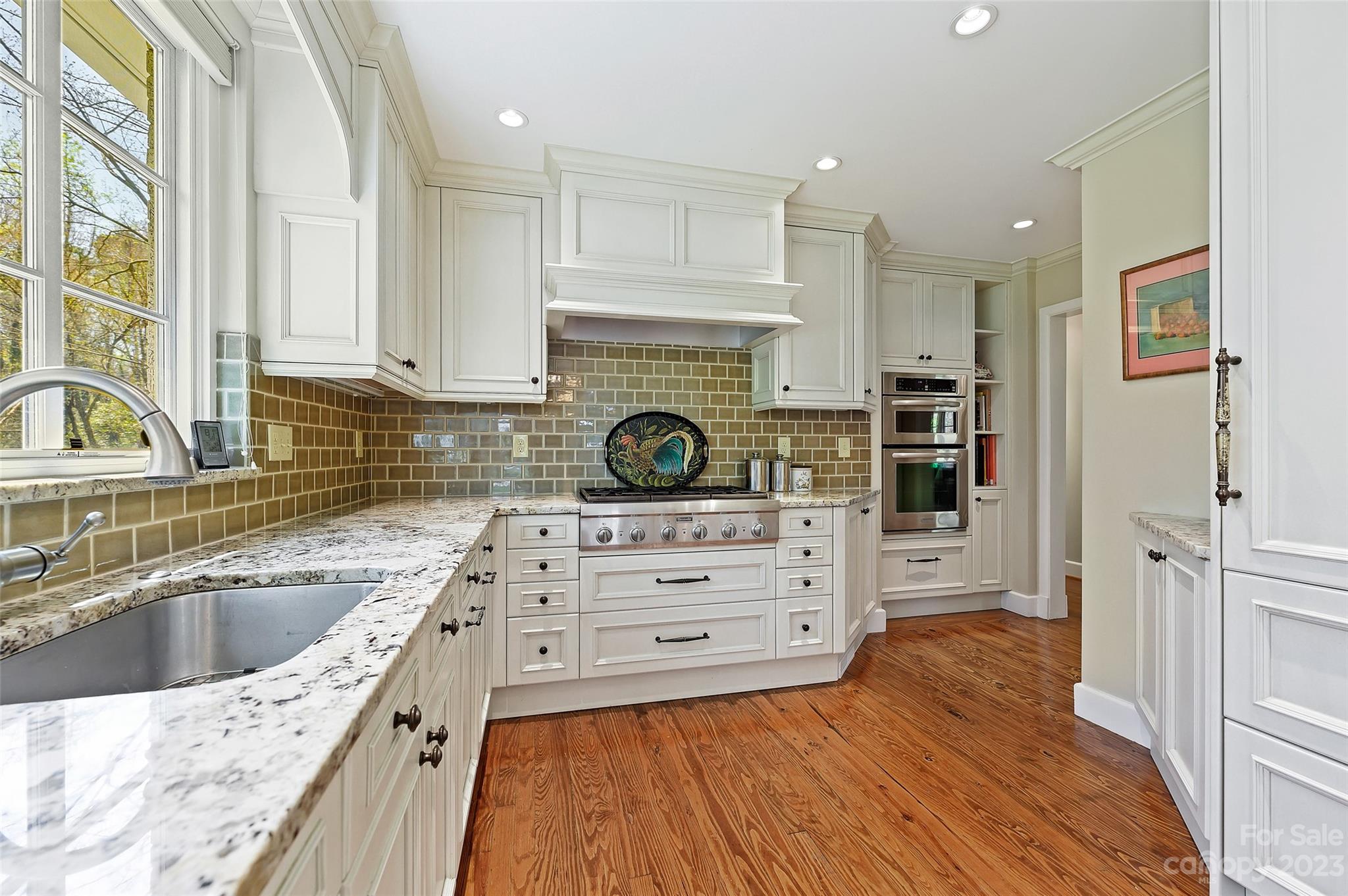 246 Shasta Lane Charlotte, NC 28211 - Photo 13 of 48 a kitchen with stainless steel appliances granite countertop a sink a stove and cabinets
