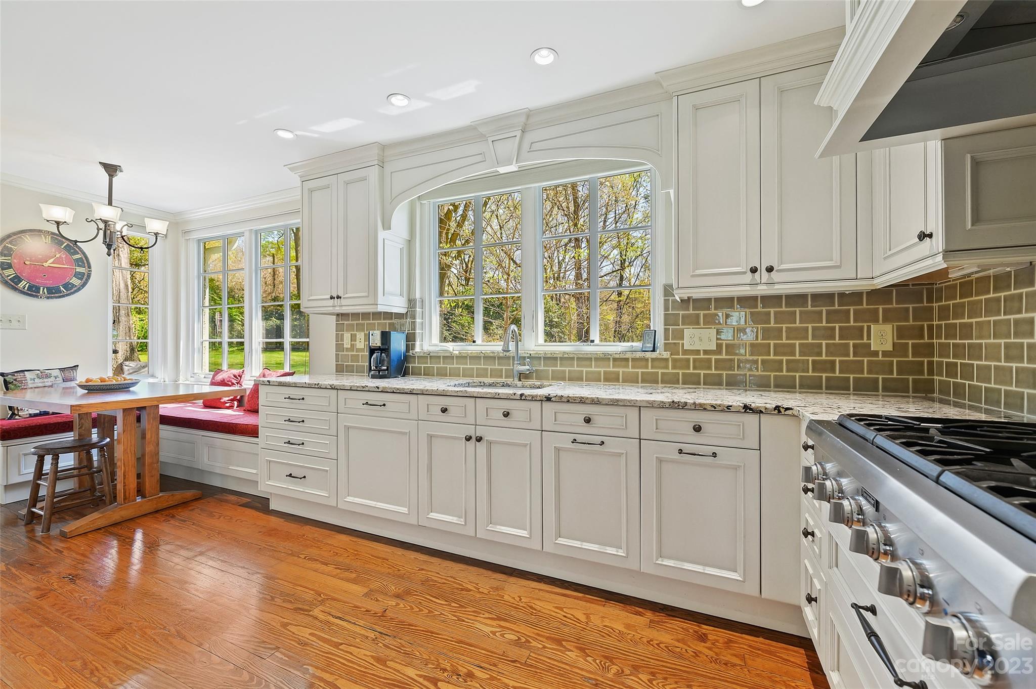 246 Shasta Lane Charlotte, NC 28211 - Photo 15 of 48 a kitchen that has a lot of cabinets in it and wooden floors
