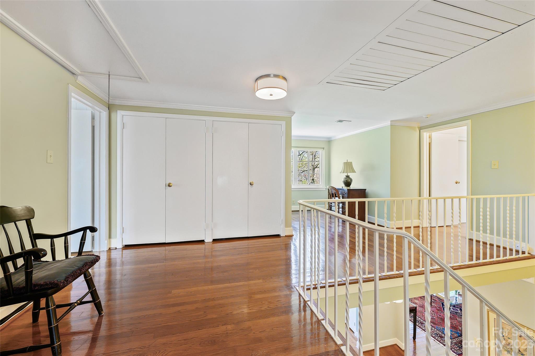 246 Shasta Lane Charlotte, NC 28211 - Photo 25 of 48 a view of a hallway with wooden floor and staircase