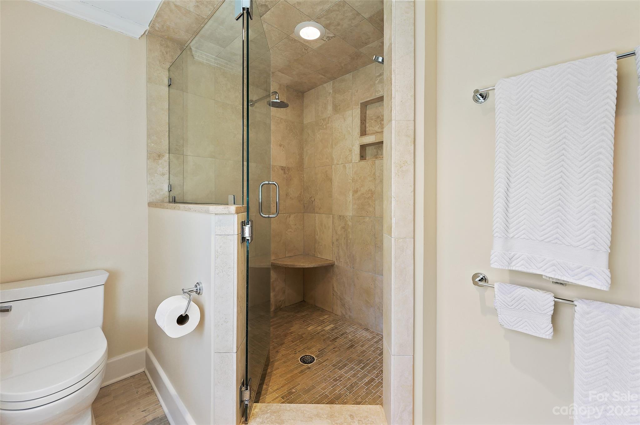 246 Shasta Lane Charlotte, NC 28211 - Photo 30 of 48 a bathroom with a granite countertop toilet a sink and shower