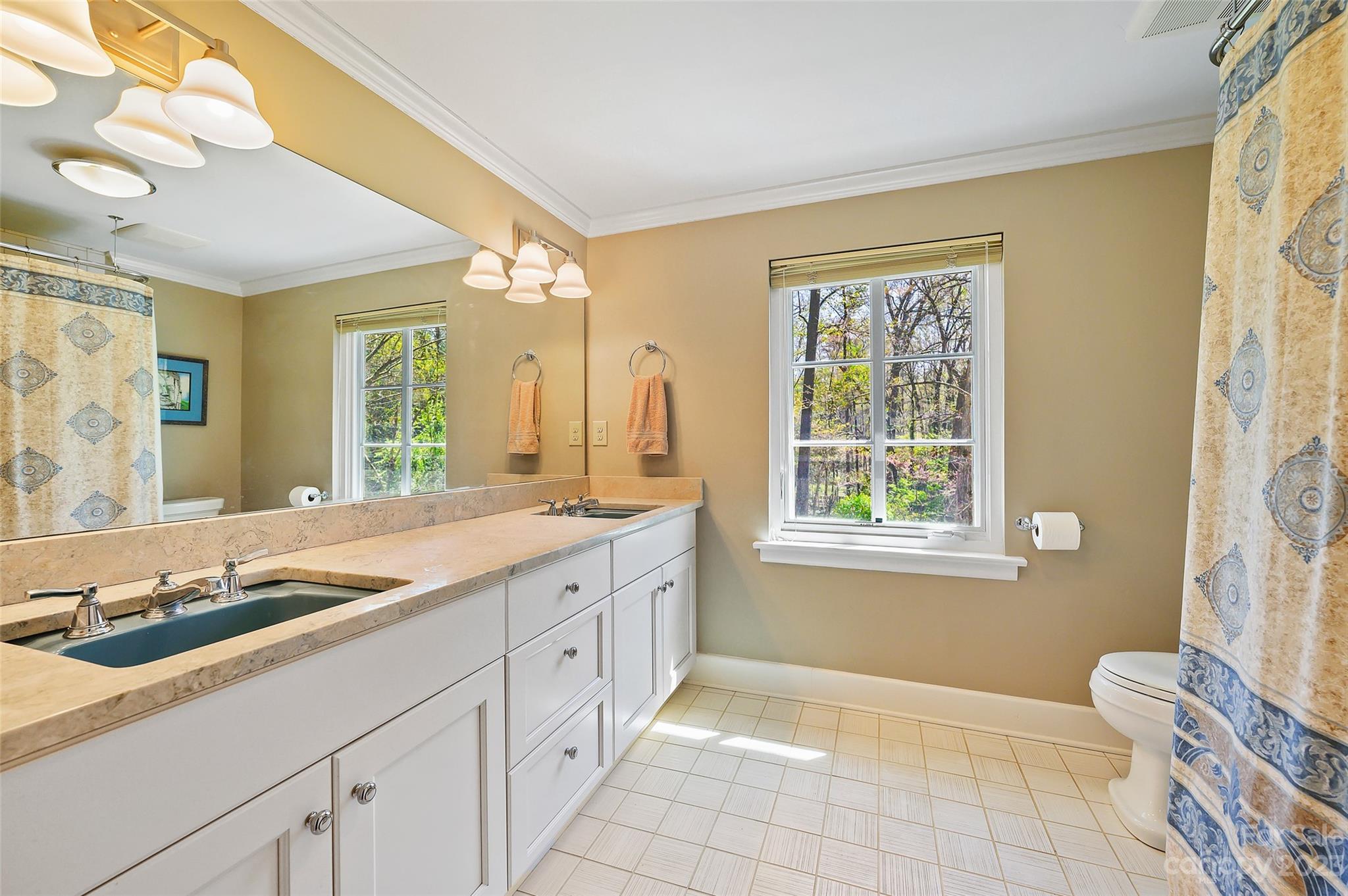 246 Shasta Lane Charlotte, NC 28211 - Photo 32 of 48 a spacious bathroom with sinks mirror and a bathtub