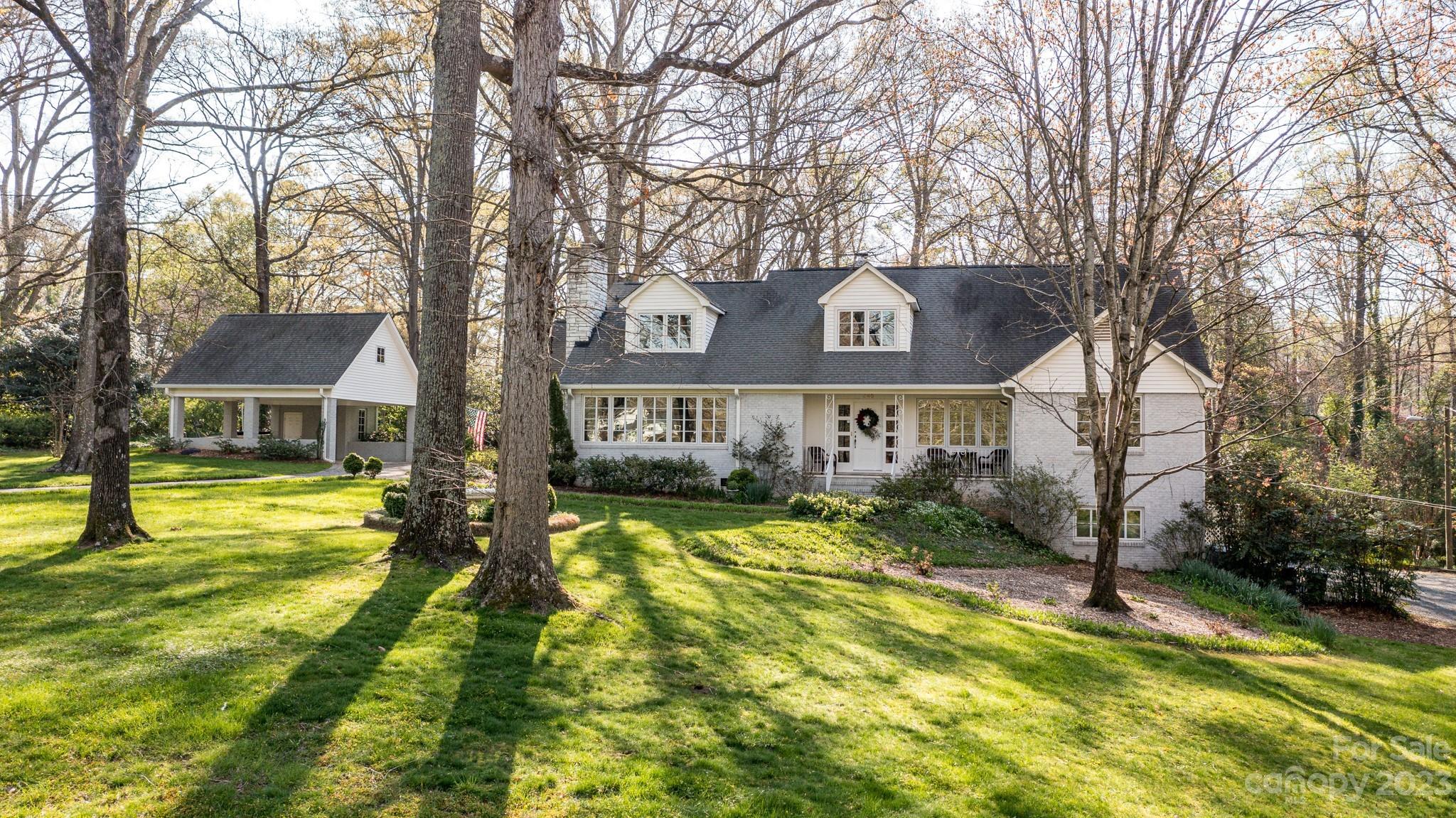 246 Shasta Lane Charlotte, NC 28211 - Photo 43 of 48 a front view of a house with swimming pool and trees