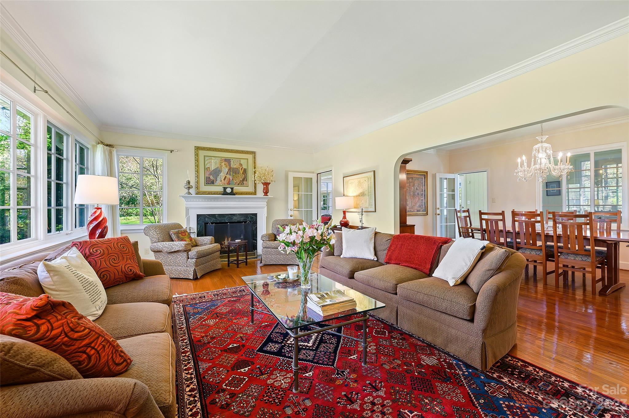 246 Shasta Lane Charlotte, NC 28211 - Photo 6 of 48 a living room with furniture wooden floor and a fireplace