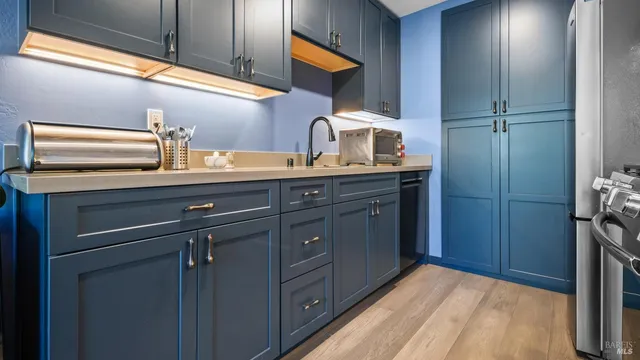 a kitchen with a sink and cabinets
